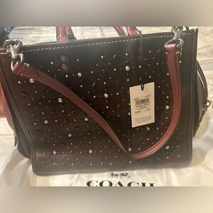 PRAIRIE RVT ROGUE- 
Coach Dark Brown Studded Satchel